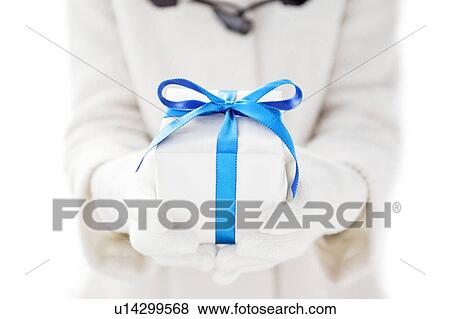 Stock Photo - Woman Holding Present. Fotosearch