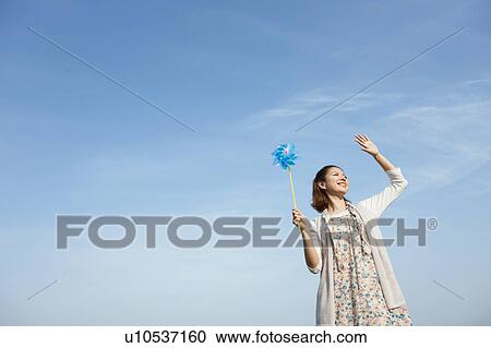 Young woman feeling the wind View Large Photo Image Stock Image - Young woman feeling the wind. Fotosearch