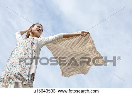 Young woman feeling the wind View Large Photo Image Stock Image - Young woman feeling the wind. Fotosearch