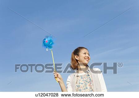 Young woman feeling the wind View Large Photo Image Stock Photo - Young woman feeling the wind. Fotosearch