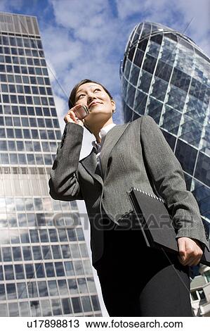 Stock Image - Young Woman on Phone. Fotosearch