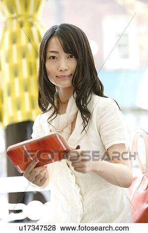 Stock Photo - Young Woman Shopping. Fotosearch