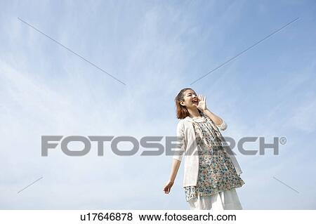 Young woman shouting View Large Photo Image Stock Photo - Young woman shouting. Fotosearch