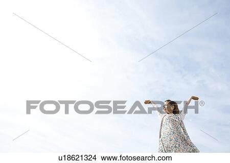 Young woman stretching View Large Photo Image Picture - Young woman stretching. Fotosearch