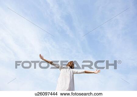 Picture - Young woman stretching. Fotosearch