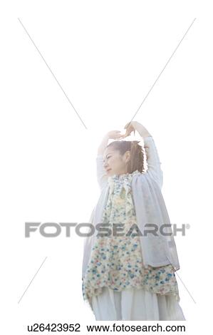 Young woman stretching View Large Photo Image Stock Image - Young woman stretching. Fotosearch