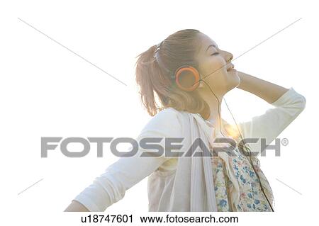 Young woman with headphones View Large Photo Image Stock Image - Young woman with headphones. Fotosearch