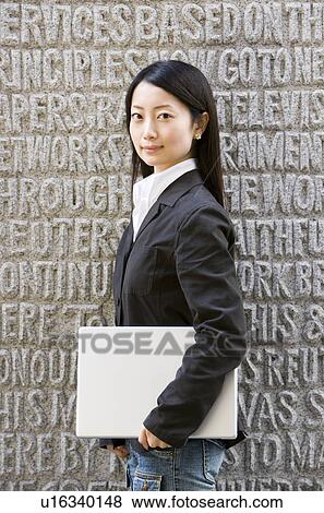 Stock Photo - Young Woman with Laptop. Fotosearch