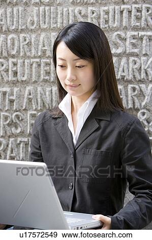 Stock Photo - Young Woman with Laptop. Fotosearch