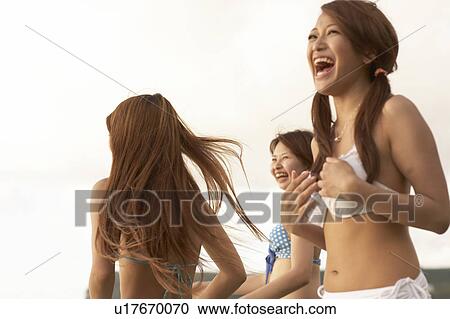 Young women laughing in bikini, Guam, USA View Large Photo Image Stock Image - Young women laughing in bikini, Guam, USA. Fotosearch