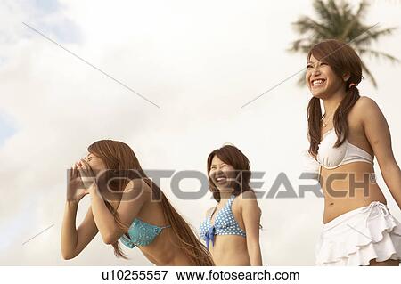 Young women shouting and laughing in bikini, Guam, USA View Large Photo Image Stock Photo - Young women shouting and laughing in bikini, Guam, USA. Fotosearch