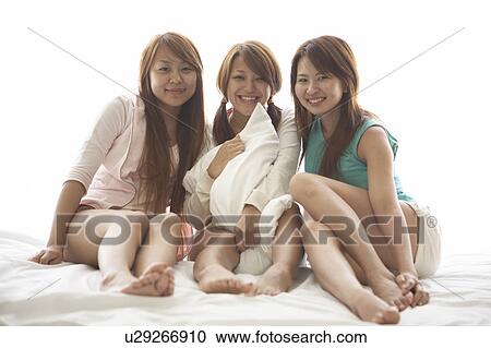 Young women smiling View Large Photo Image Stock Image - Young women smiling. Fotosearch