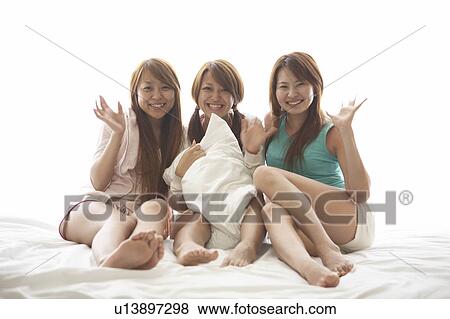 Young women smiling View Large Photo Image Stock Photo - Young women smiling. Fotosearch