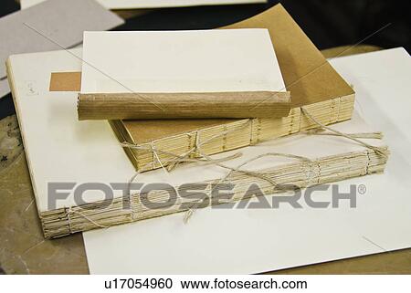 Stock Image - Book binding workshop. Fotosearch