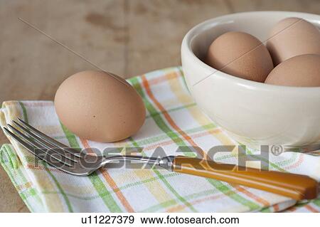 Bowl of boiled eggs with fork View Large Photo Image Stock Photo - Bowl of boiled eggs with fork. Fotosearch
