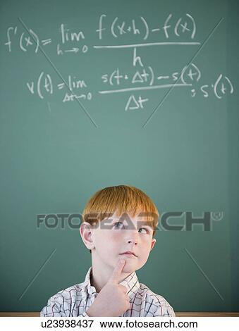 Boy (8-9) calculating equation by blackboard View Large Photo Image Stock Photo - Boy (8-9) calculating equation by blackboard. Fotosearch