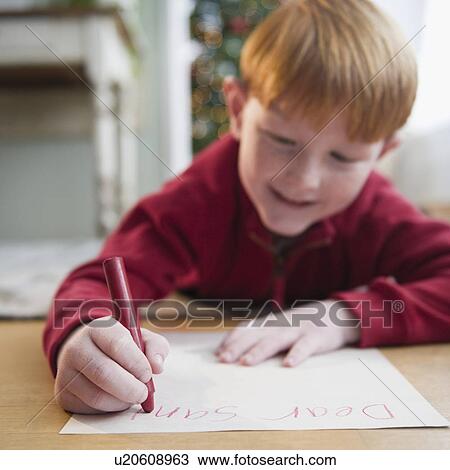 Boy (8-9) writing letter to Santa View Large Photo Image Stock Image - Boy (8-9) writing letter to Santa. Fotosearch
