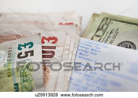 Stock Photo - British and American paper currency, close-up. Fotosearch