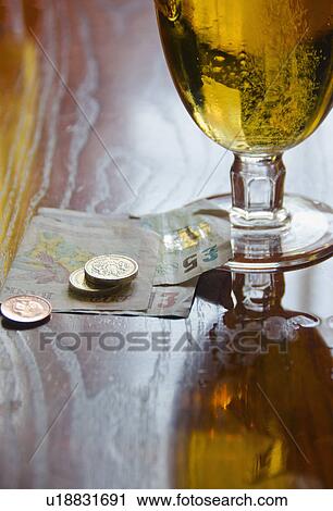British currency and beer on table View Large Photo Image Stock Image - British currency and beer on table. Fotosearch