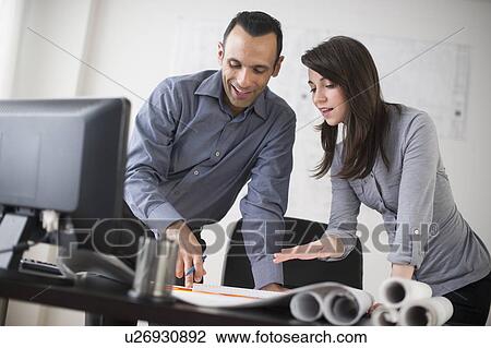 Business man and woman studying blueprints View Large Photo Image Stock Image - Business man and woman studying blueprints. Fotosearch