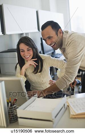 Business man and woman working in office View Large Photo Image Stock Photograph - Business man and woman working in office. Fotosearch