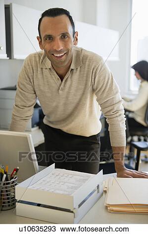 Business man in office View Large Photo Image Stock Image - Business man in office. Fotosearch