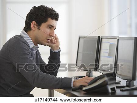 Business man using computer in office View Large Photo Image Picture - Business man using computer in office. Fotosearch