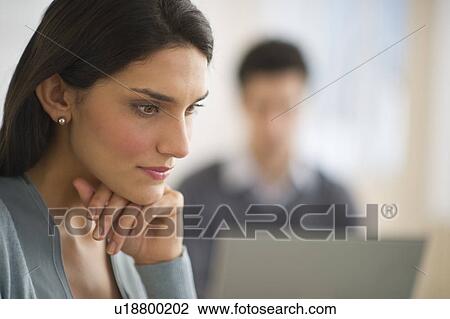 Business woman with hand on chin View Large Photo Image Stock Image - Business woman with hand on chin. Fotosearch