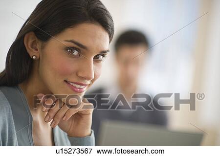 Stock Photo - Business woman with hand on chin. Fotosearch