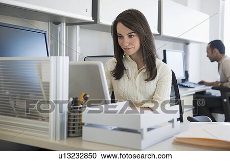 Business woman working in office View Large Photo Image Stock Image - Business woman working in office. Fotosearch