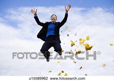Stock Image - Businessman mid-air. Fotosearch
