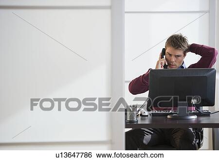 Businessman working in office View Large Photo Image Stock Photograph - Businessman working in office. Fotosearch