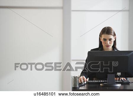 Businesswoman working in office View Large Photo Image Stock Image - Businesswoman working in office. Fotosearch