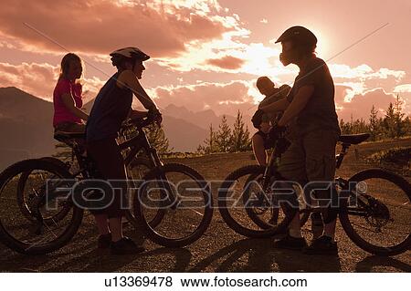 Canada, British Columbia, Fernie, Four people on bike trip View Large Photo Image Stock Photo - Canada, British Columbia, Fernie, Four people on bike trip. Fotosearch