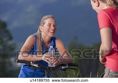 Canada, British Columbia, Fernie, Two women on bike trip View Large Photo Image Stock Photography - Canada, British Columbia, Fernie, Two women on bike trip. Fotosearch