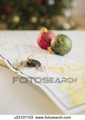 Car keys and baubles on map View Large Photo Image Stock Image - Car keys and baubles on map. Fotosearch