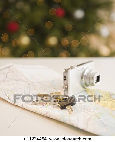 Car keys and camera on map View Large Photo Image Picture - Car keys and camera on map. Fotosearch