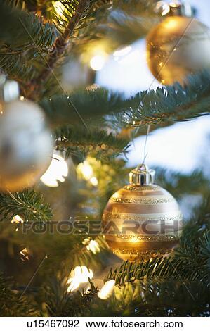 Stock Image - Christmas decoration hanging on Christmas tree, studio shot. Fotosearch