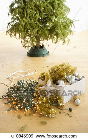 Christmas tree and christmas ornaments on floor View Large Photo Image Stock Photo - Christmas tree and christmas ornaments on floor. Fotosearch
