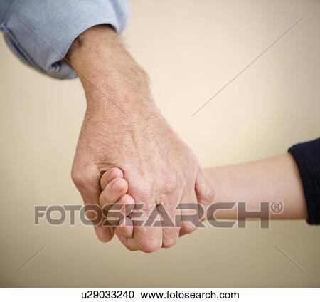 Close up grandfather and grandson (8-9) holding hands View Large Photo Image Stock Image - Close up grandfather and grandson (8-9) holding hands. Fotosearch