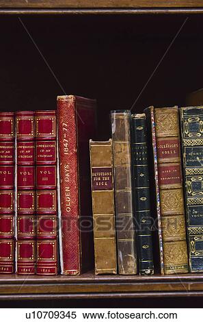 Stock Photography - Close up of antique books on shelf. Fotosearch