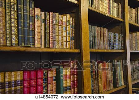 Close up of antique books on shelves View Large Photo Image Stock Image - Close up of antique books on shelves. Fotosearch