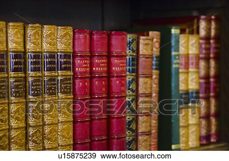 Stock Photo - Close up of antique books on shelves. Fotosearch
