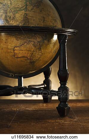 Picture - Close up of antique globe on table. Fotosearch
