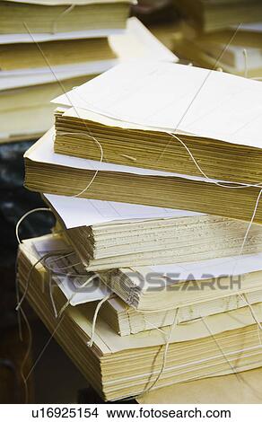Picture - Close up of books without covers being prepared for binding. Fotosearch