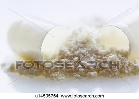 Close up of broken drug capsule View Large Photo Image Picture - Close up of broken drug capsule. Fotosearch
