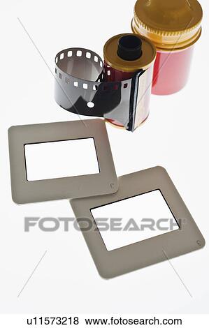 Stock Photo - Close up of camera film and slide frames on light box. Fotosearch