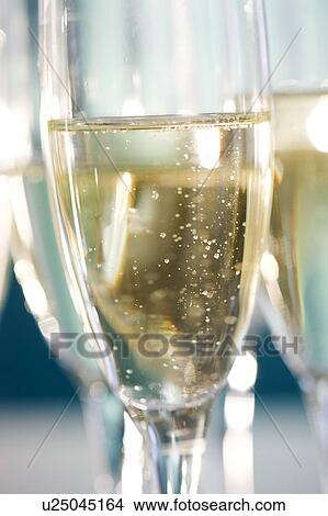Picture - Close up of champagne flutes. Fotosearch