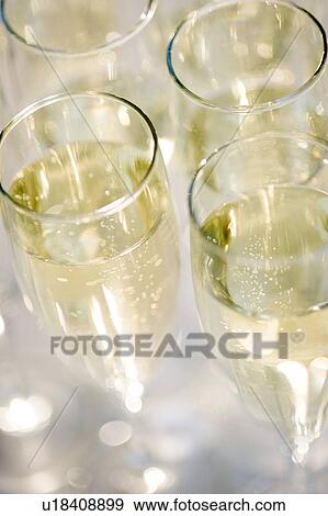 Stock Photo - Close up of champagne flutes. Fotosearch
