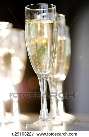 Stock Photo - Close up of champagne flutes. Fotosearch